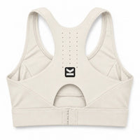 Top deportivo ASTRA de VALTIK en color Nácar, vista posterior del producto con ventilación y cierre ajustable.